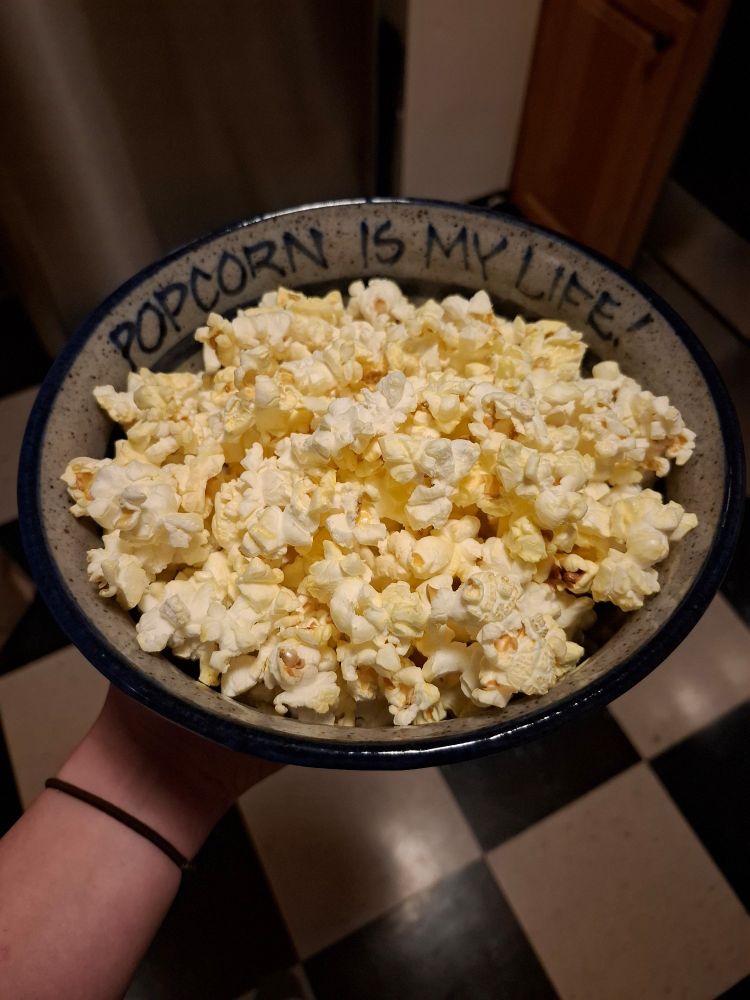 The same bowl, now filled with popcorn. The text "popcorn is my life!" Is still visible on the bowl.