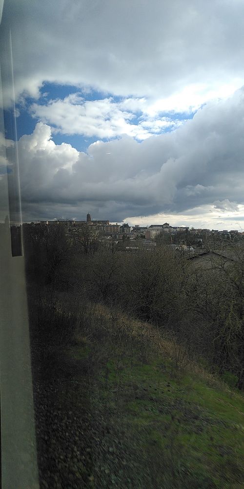 View rolling into Rodez, with the cathedral tower poking up high into the air