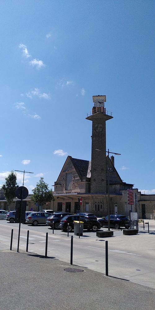 Railway station at Dinan. Lovely 1930s stone build with a tall tower.