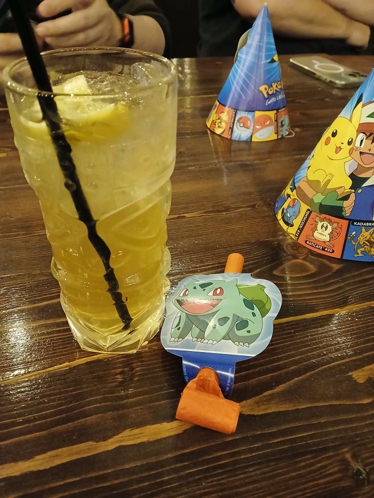 A cocktail next to some Pokémon merchandise