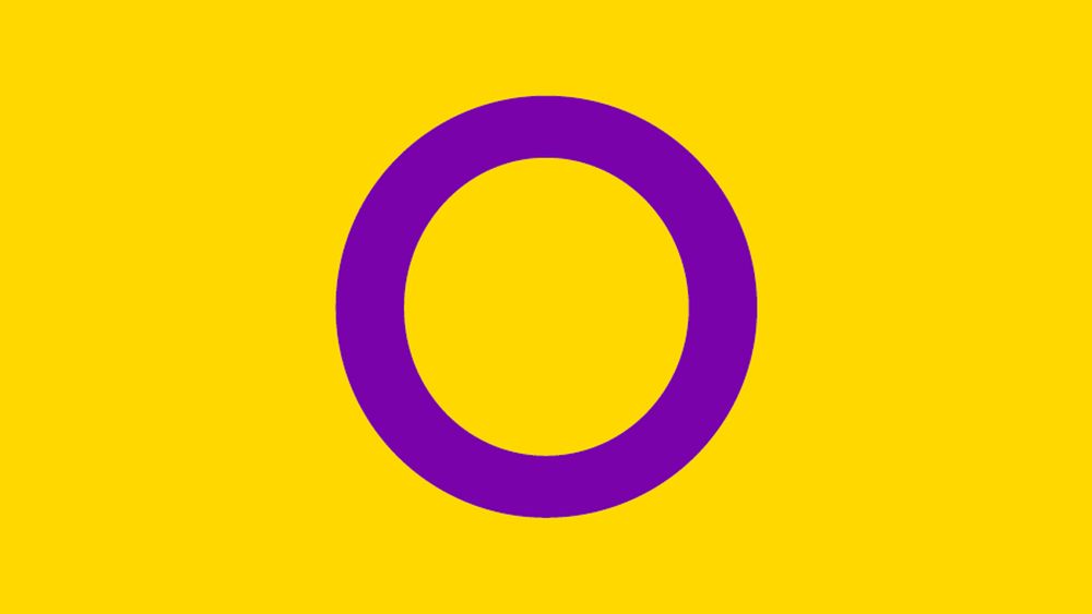 The intersex flag. A purple circle on a yellow background. 