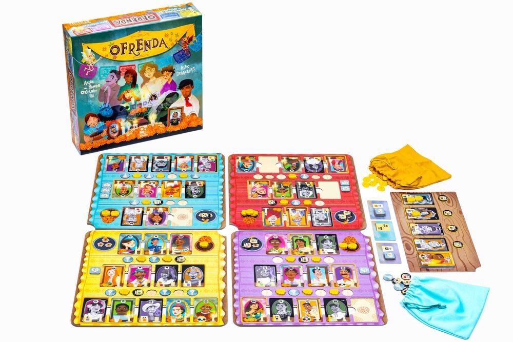 A photo of the game box for the board game Ofrenda alongside the game components: 4 player boards, a market board, two cloth bags, all covered with various illustrated cards as well as wooden and cardboard pieces.