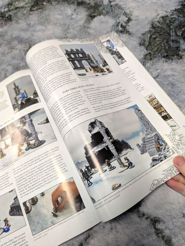 A photo of another spread from the same article, showing more detailed photos of the figures and terrain alongside a description of how this particular game unfolded turn by turn.