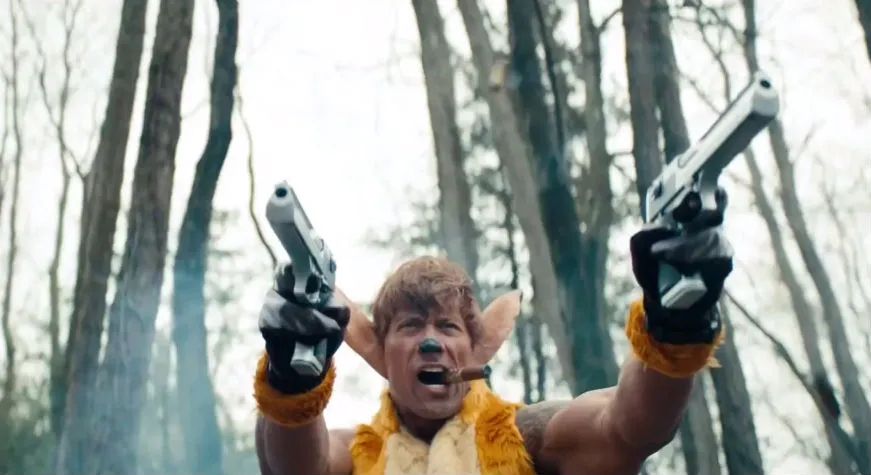 Dwayne The Rock Johnson as a cigar-chomping deer pointing two pistols. From a parody Bambi movie trailer on Saturday Night Live.