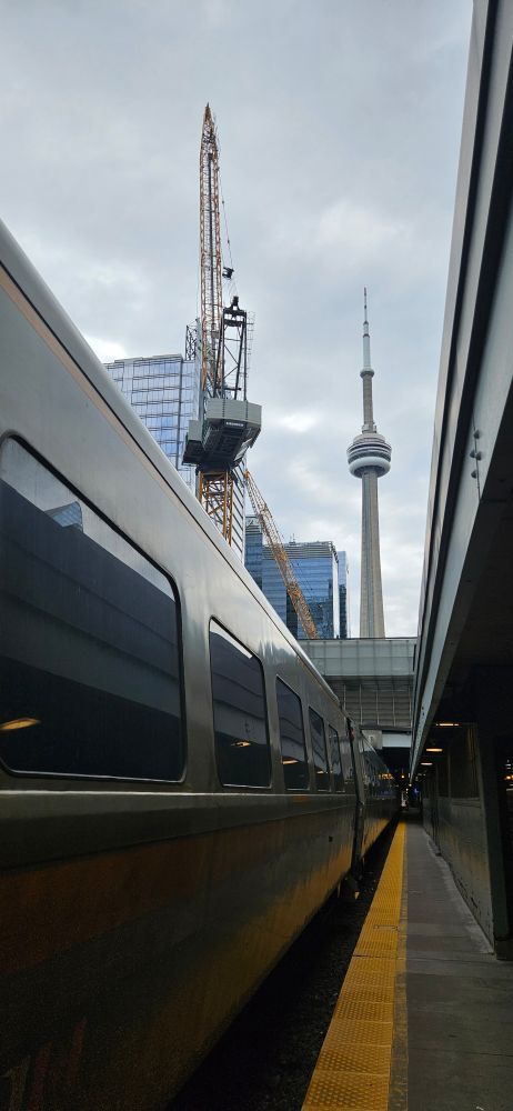 A view from the platform at Toronto Union Station, with CN tower in the background. 
