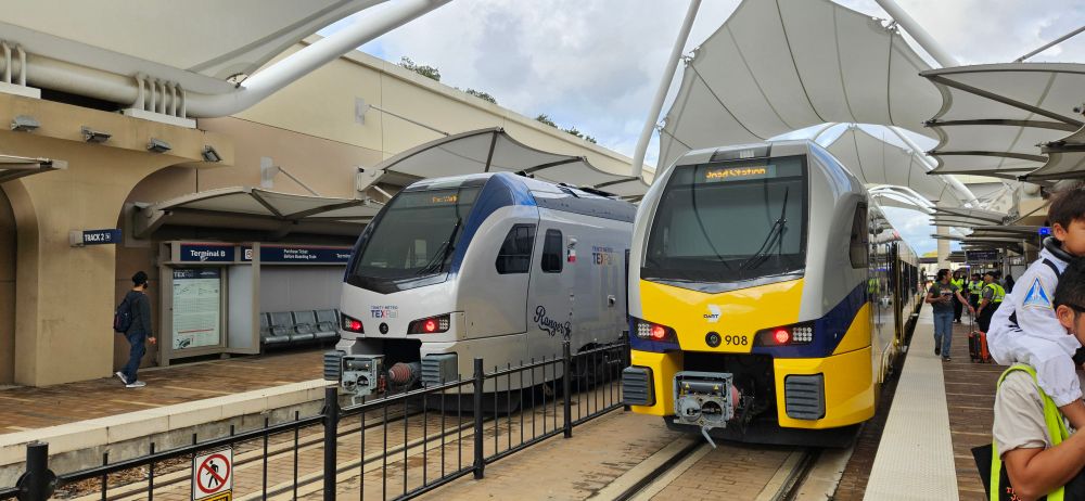 TexRail and Silver Line trains next to each other at DFW Terminal B Station 