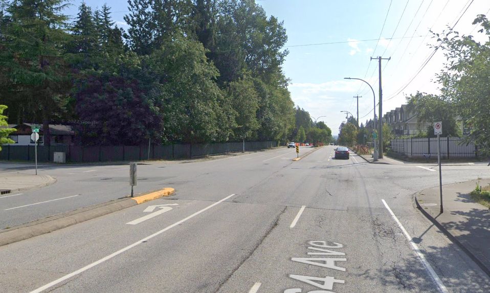 google streetview screenshot of 64th ave. A very wide street with 5 lanes. 