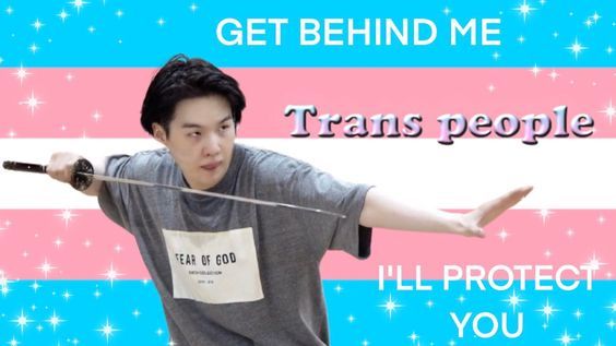 Yoongi holding a sword in front of a trans flag background with sparkles and the words "Get behind me trans people, I'll protect you"