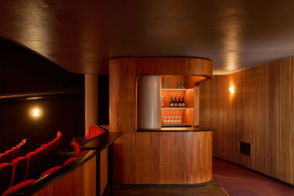 A wood-clad cinema with a central bar