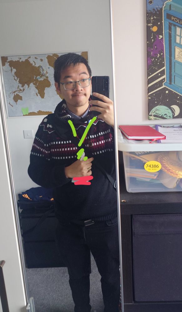 Me, stood in front of a mirror in jeans and a jumper