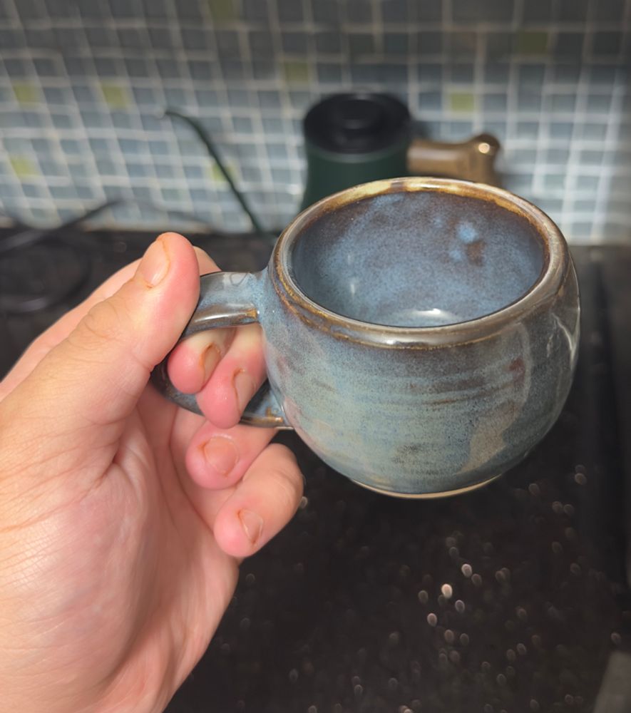 The opposite side of the same mug. Here the glaze doesn’t break as much, but the blue pigment has settled satisfyingly along the throwing rings