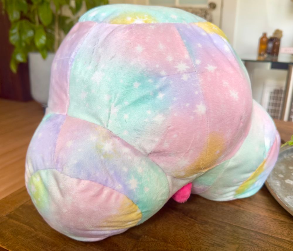 The same plush at a 3/4ths view. You can see more clearly just how plump the belly is.