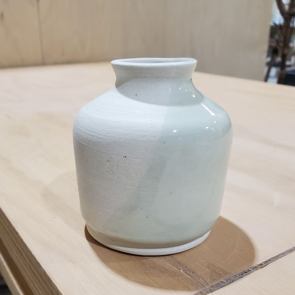 Ceramic pot with half sagebrush celadon glaze.