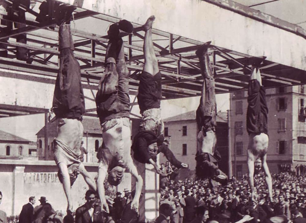 The bullet-riddled corpses of Mussolini, his mistress and two ministers suspended from meathooks in Milan