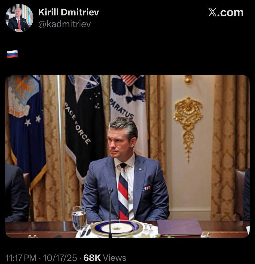 Secretary of "War" Pete Hegseth sitting uncomfortably before a high class dinner setting that rather resembles a DJ controller set.