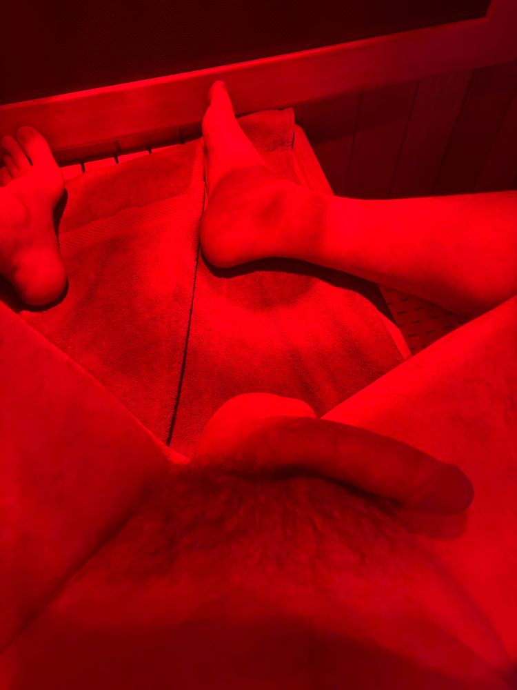 Cock and feet in red lighting
