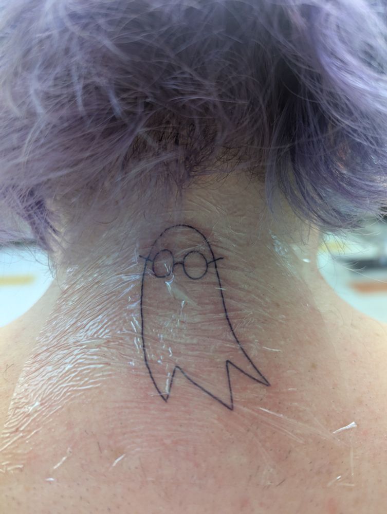 A tattoo of a ghost based on the movie, I Saw the TV Glow.