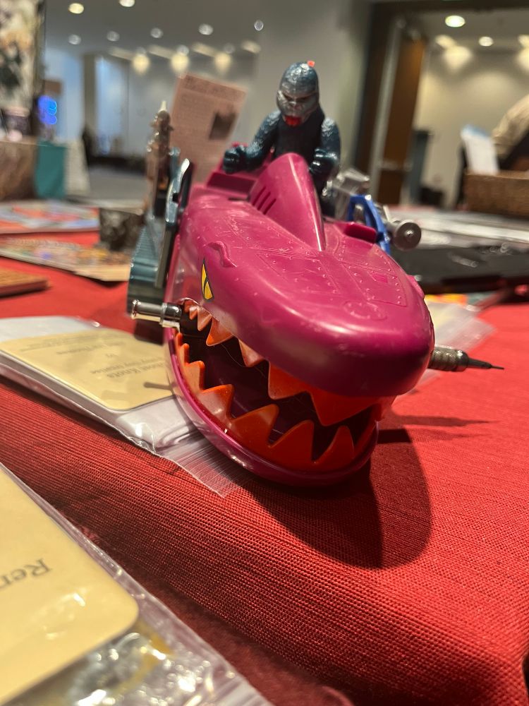 Mini shogun Godzilla fig driving the shark faced vehicle from He-Man.