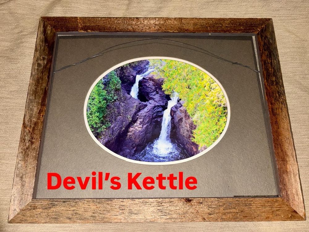 “Devils Kettle” photographed at C. R. Magney State Park near Grand Marais, Minnesota. A waterfall splits over a rhyolite cliff, and one half disappears into a hole and gradually filters back into the river. 