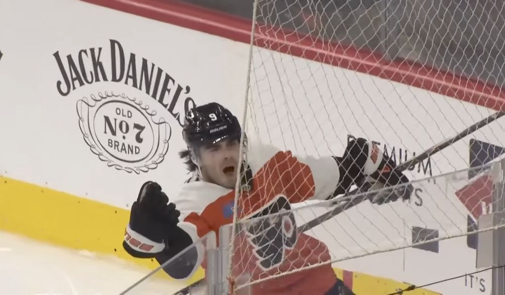 Flyers' defensemen Jamie Drysdale celebrates scoring a goal, he is fist pumping with in the corner with an uncommonly excited look on his face