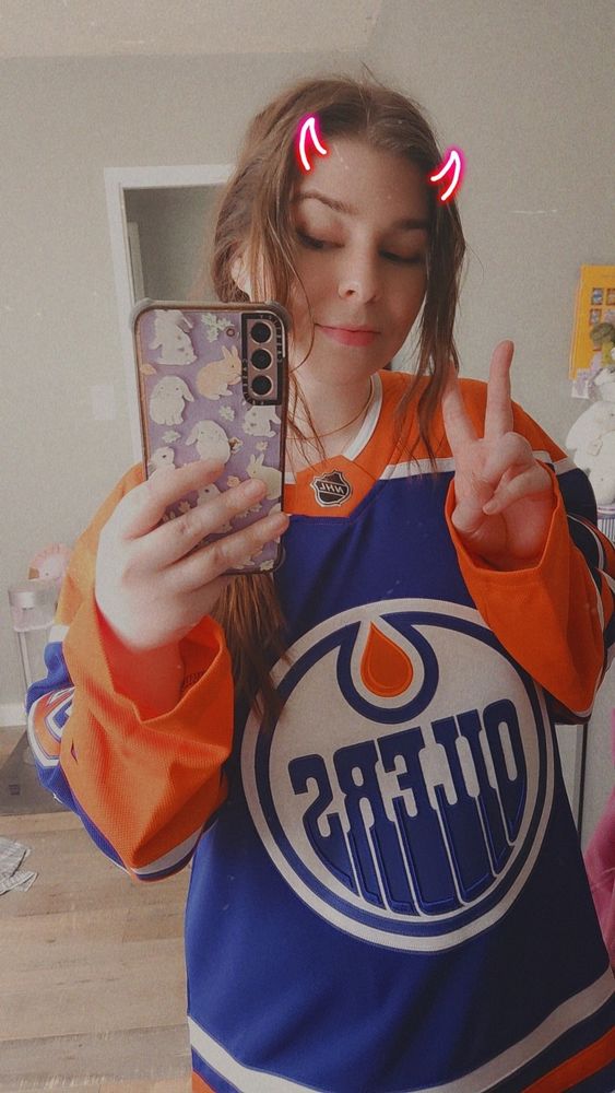 girl in Oilers jersey