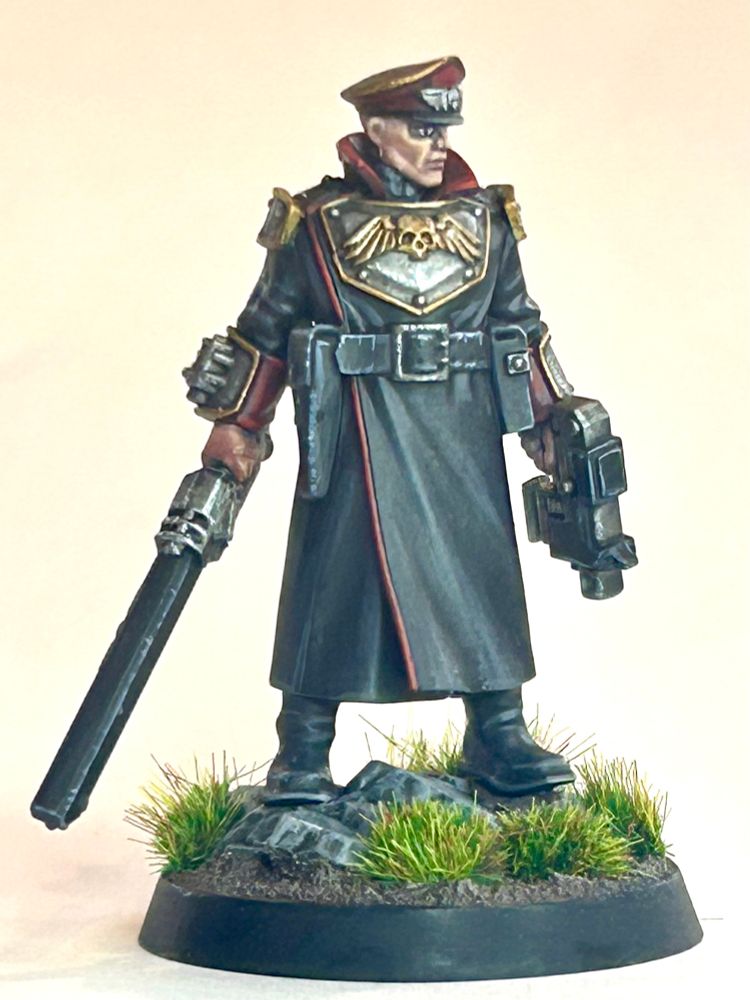 Wh40k Commissar with chainsword and bolt pistol. Sadly, he has no frogging, scarves or epaulets. Totally no nonsense. He’s like the Richard Sharpe or Sam Vimes of commissars.