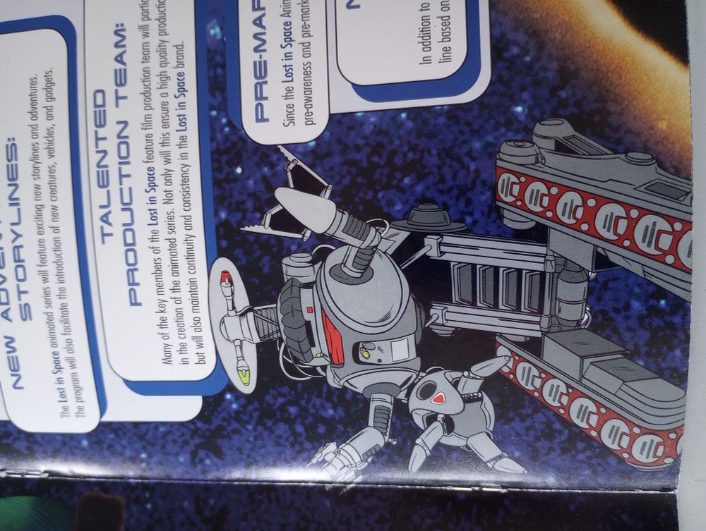 Damn the Robot looks cool animated! From the LOST IN SPACE movie licensing booklet