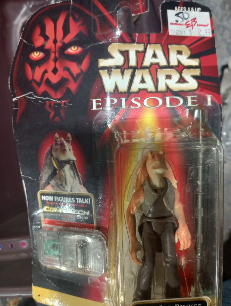 A vintage Star Wars Episode 1 Jar-Jar figure, showing an original price sticker of 2.99 at EB Games marked down to .50