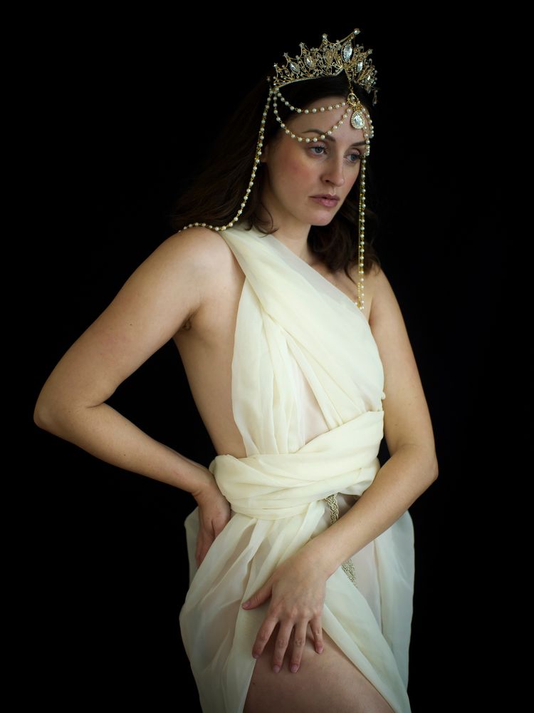 Jennifer emerging with crown, with slight emphasis on elbows.