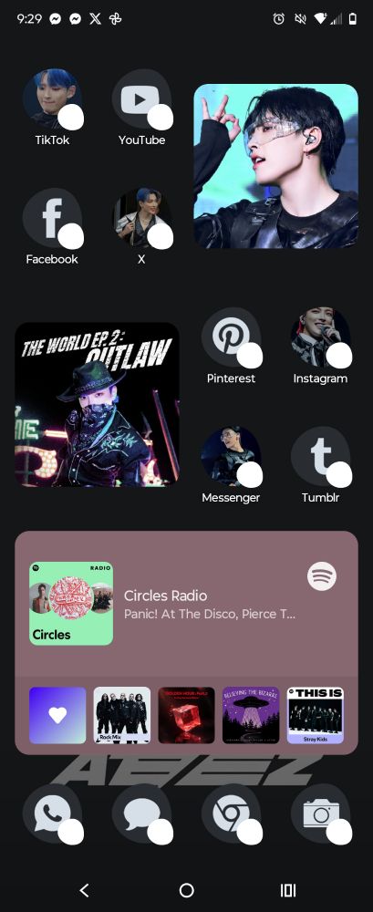 Home screen with pictures of hongjoong as the app icons and a black background with ateez written at the bottom