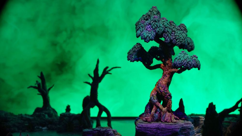 Green covered in smoke against a green backdrop.