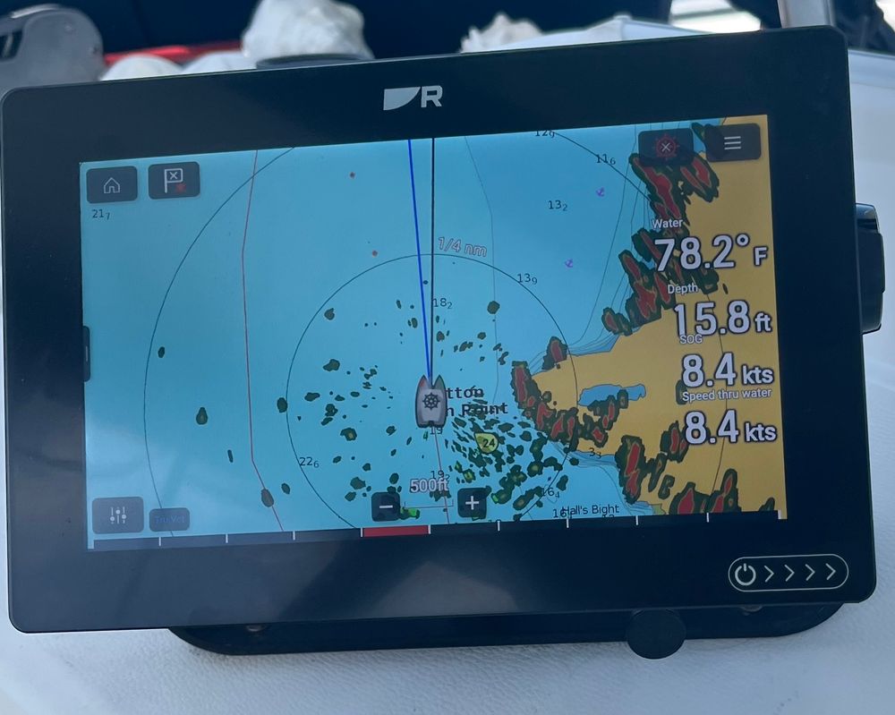 Chart plotter on a sailboat showing 8.4 knots speed over water.