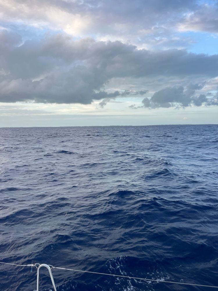 Ocean and cloudy sky as seen from a sailboat.
