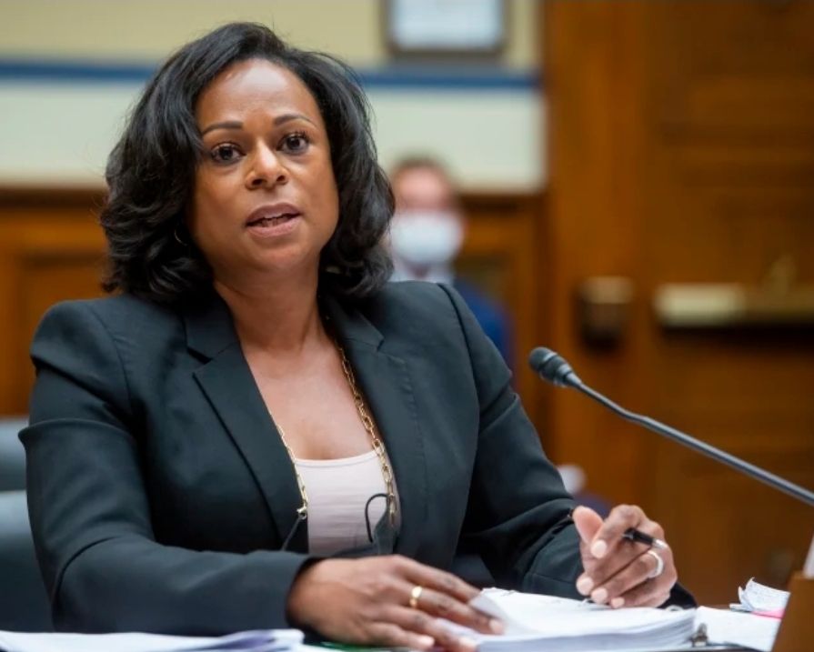 Nicole Collier, sitting in session in the Texas Legislature, looking very powerful in a black blazer. 