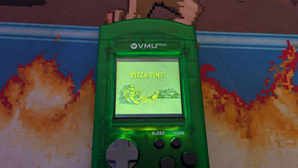TMNT Back from the Sewers running on a pre production 8Bitmods VMU Pro (in translucent green with a purple wrist strap)