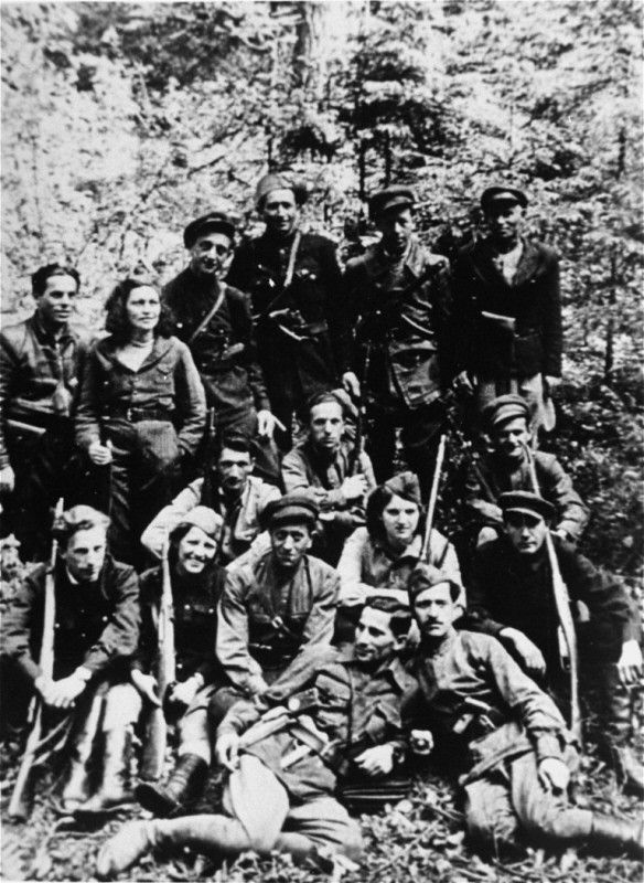 Group portrait of a Jewish partisan unit operating in the Lithuanian forests. Many of its members had been involved in resistance activities in the Kovno ghetto. Lithuania, 1944.