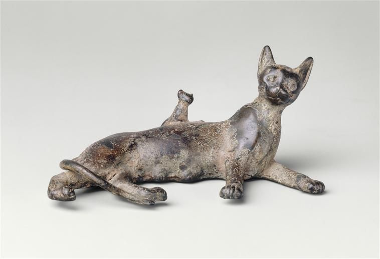 Bronze sculpture of a Bastet cat lying with her kitten. 
Egyptian, Ptolemaic Period (332-30 BCE)
Housed at the Louvre Museum