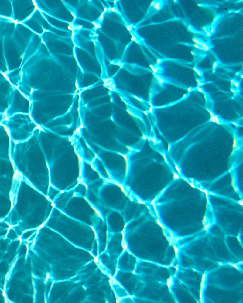 This is a photo of the mesmerising patterns created by caustic refraction on the bottom of a swimming pool on 3 August 2025