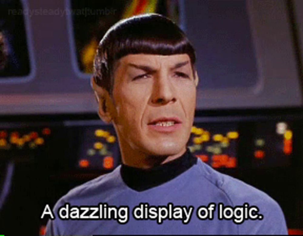 a man says " a dazzling display of logic " in front of a monitor