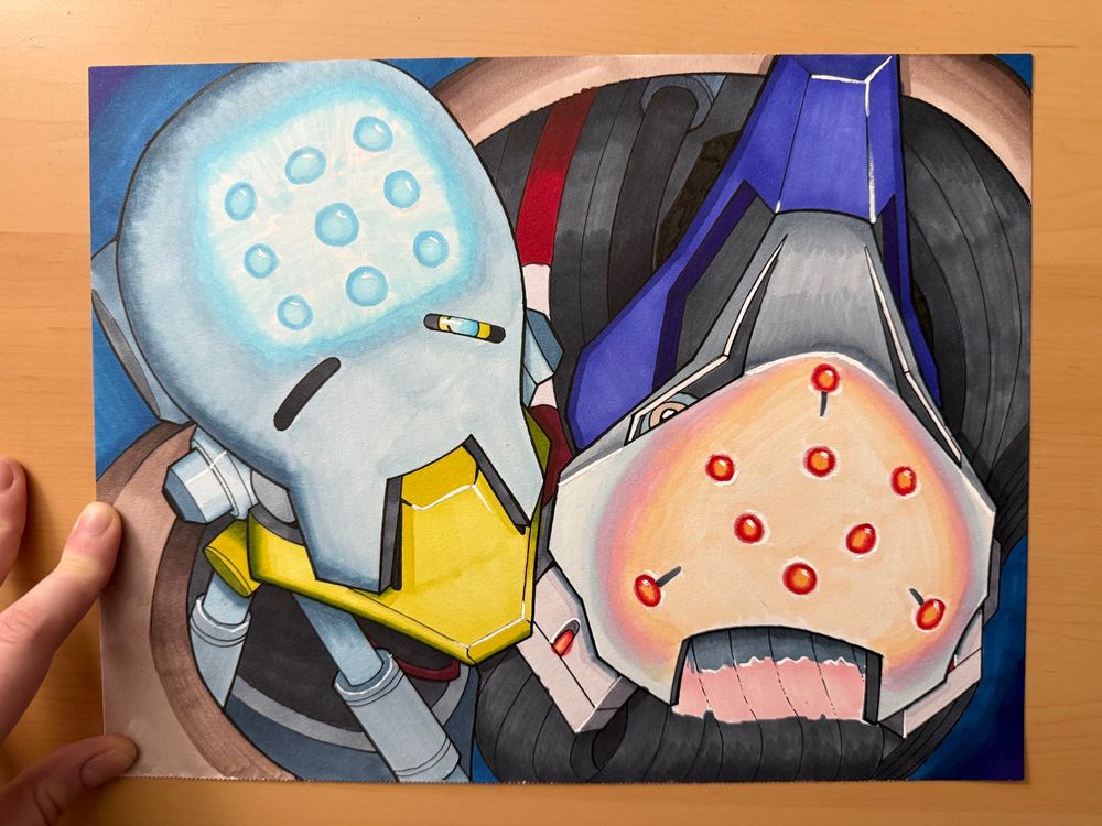A photo of an illustration similar to the image on the left, but colored with alcohol markers and white ink. A hand holds the image flat on the left.