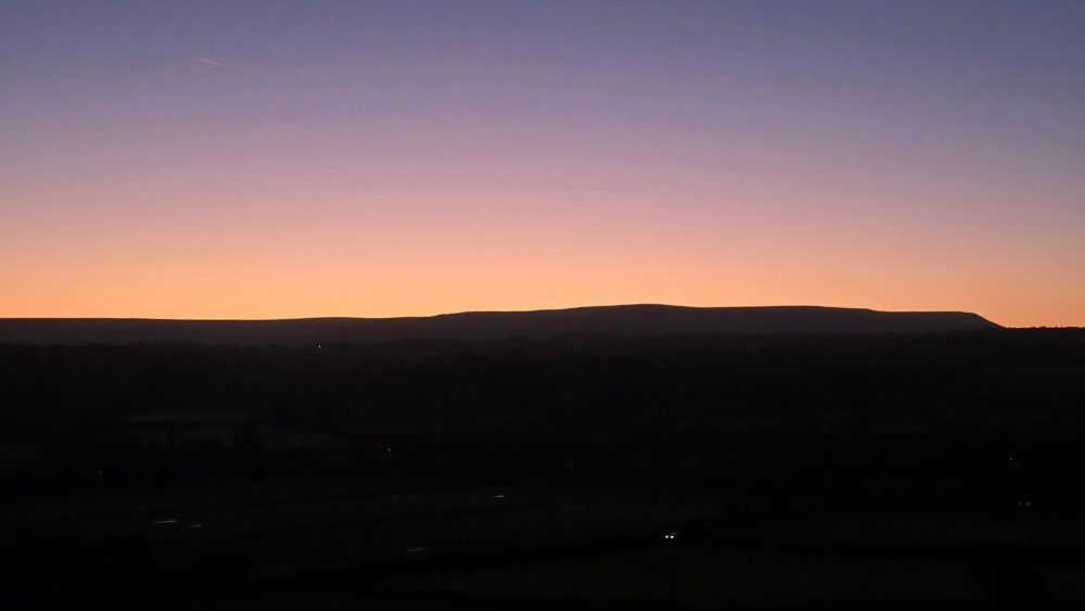 Sunset over some distant mountains in the UK.