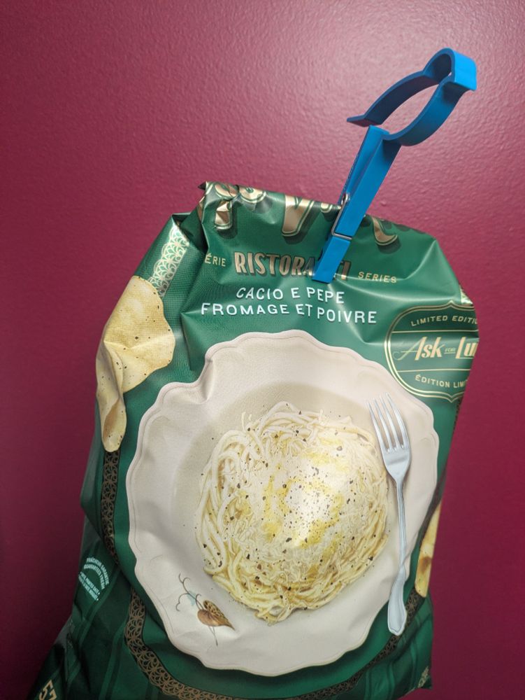Ms Vicky's ristoranti series potato chips. Green bag with a picture of a white pasta plate filled with cacio e pepe, fork resting on the right side of pasta. Label on the side reads Ask for Luigi. Limited edition. 