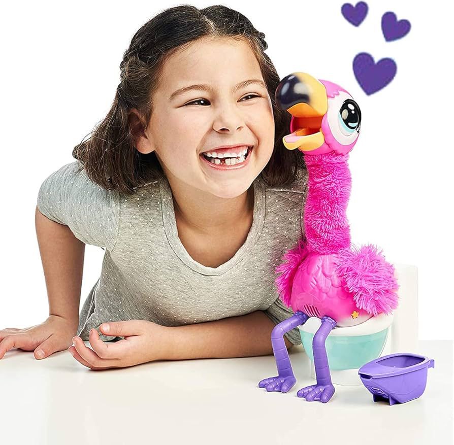 A girl cuddling a toy flamingo who is pooping on a toilet