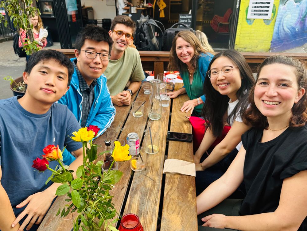 A table with smiling scientists 