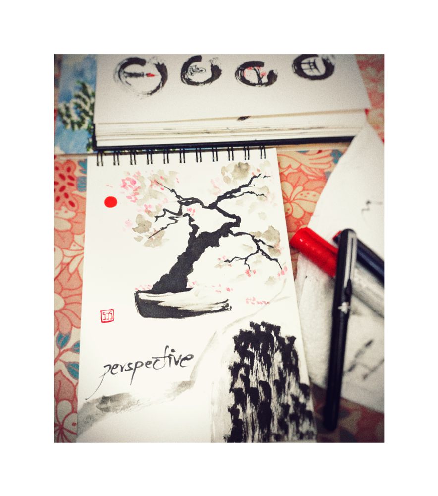 A sumi-e like painting in a sketchbook.

A bonsai in a planter with vague clouds of leaves and pink flowers. A grey branch streaks across the frame with the word 'Perspective' written above it.