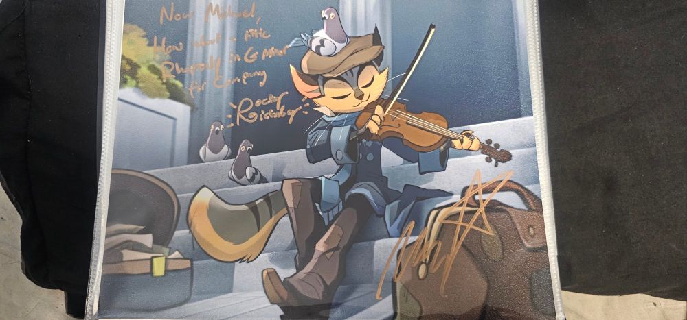 An autograph art of Rocky Rickaby from the season 1 teaser of Lackadaisy signed by Michael Kovach. The quote reads, "Now Michael, how about a little rhapsody in G minor for company"