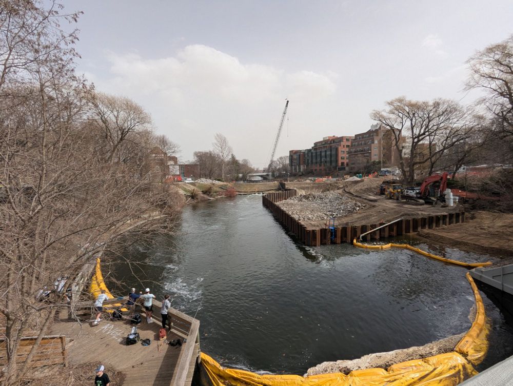 Photo from bridge overlooking construction of FishPass restoration project on the Boardman (Ottaway) River, Traverse City, Michigan, re-connecting the river with Lake Michigan. FishPass will replace the deteriorating Union Street Dam with a new, complete barrier to all fish that will have the ability to sort and selectively pass desirable fishes while blocking others.