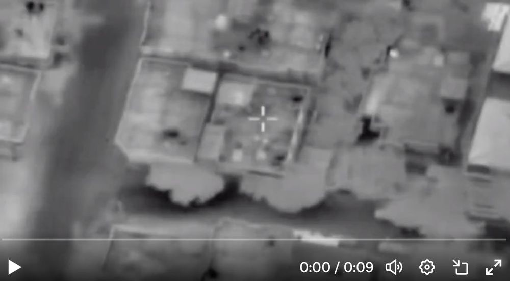 Screengrab from an Israeli Air Force eye-in-the-sky video, filmed in night-vision, before a strike on the buildings shown, in Khan Yunis, Gaza.