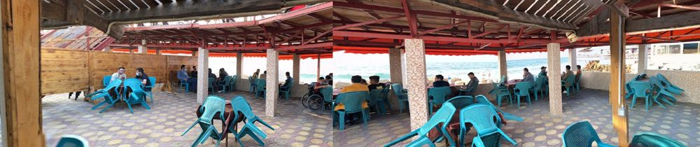 Rough panorama constructed from two screengrabs from Google Maps / Photos photosphere taken inside al-Baqa cafe, Gaza City.