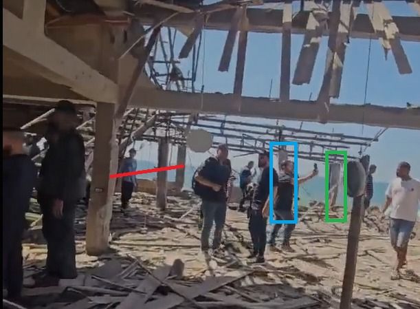 Screengrab from video by al Jazeera journalist Anas al Sharif, showing remains of al-Baqa cafe, Gaza City, 30 June 2025. A row of pillars has been marked by a red line, another pillar highlighted in blue, and a third pillar highlighted in green.